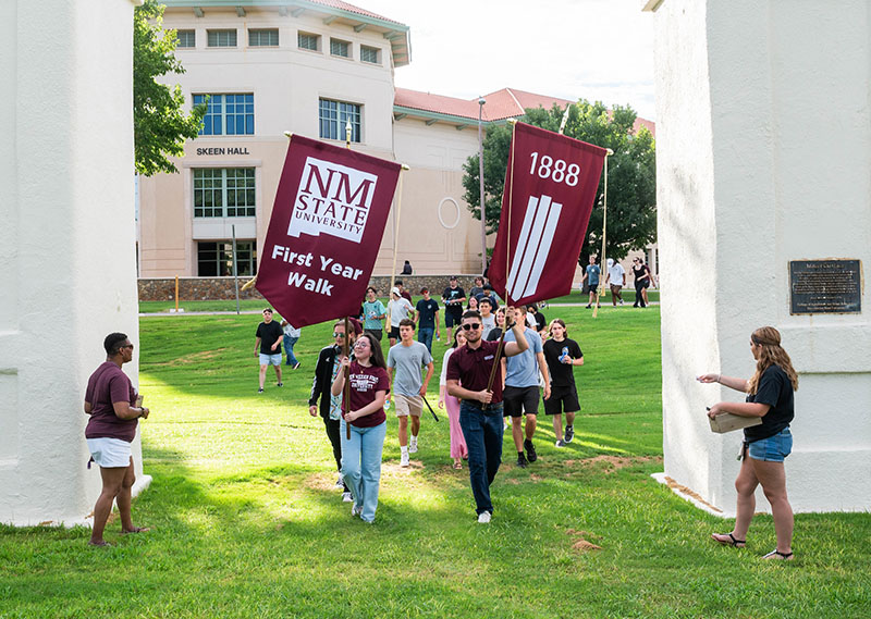 Students walking through the Miller Gates during First Year Walk